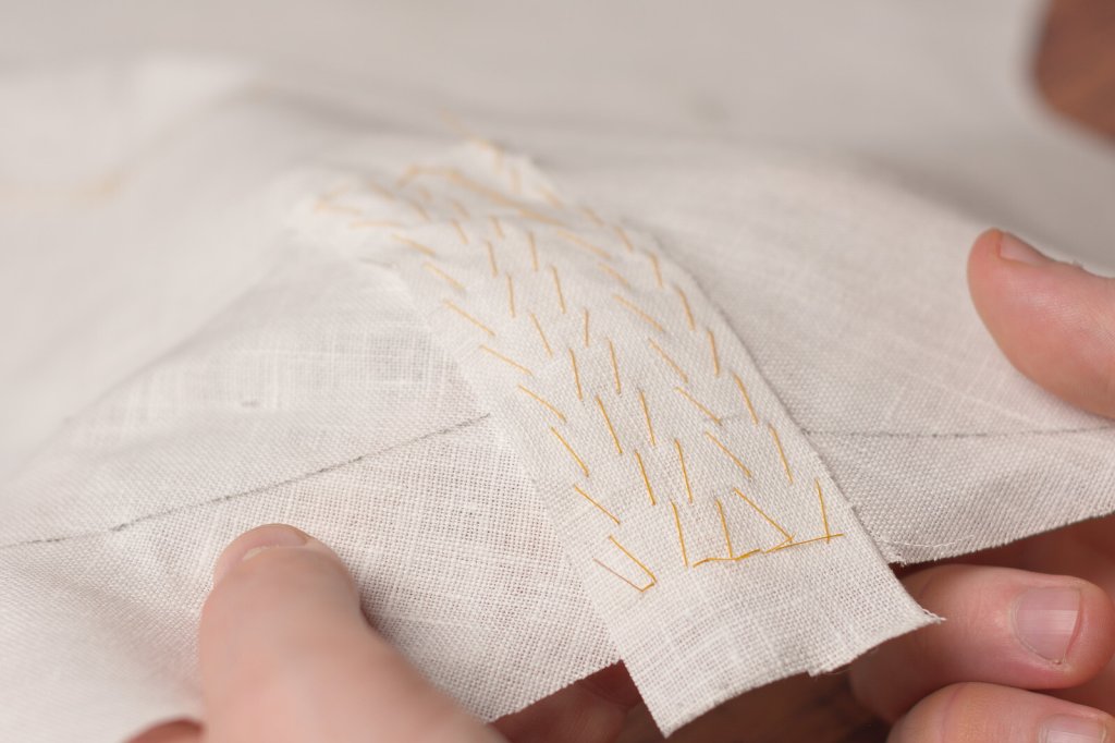 Pad stitching the waistcoat canvas.