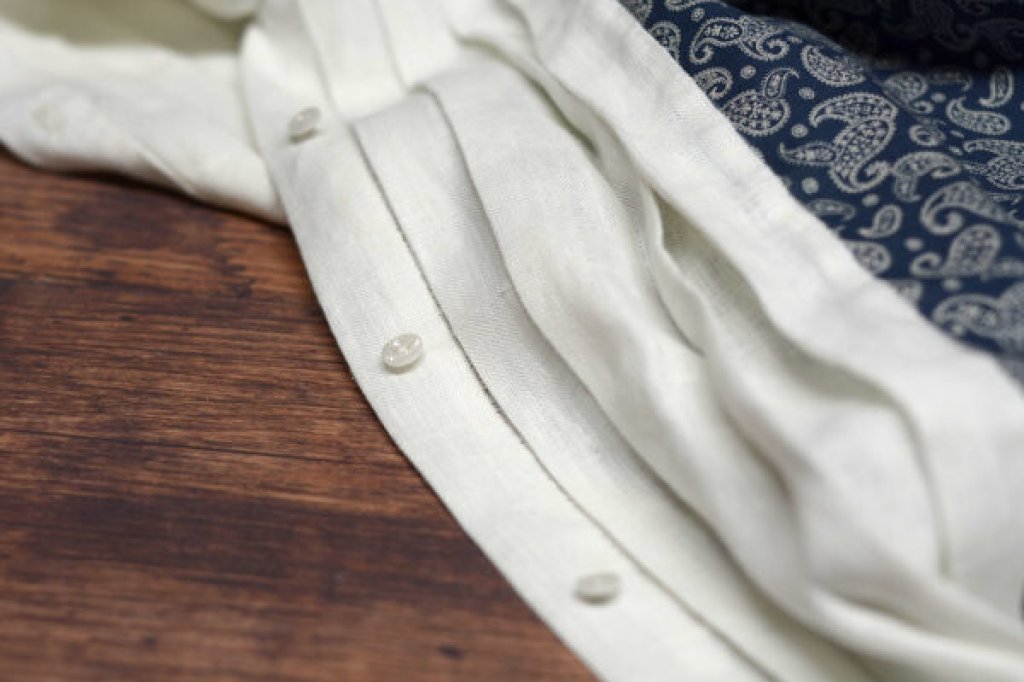 Shirt placket with pleats.