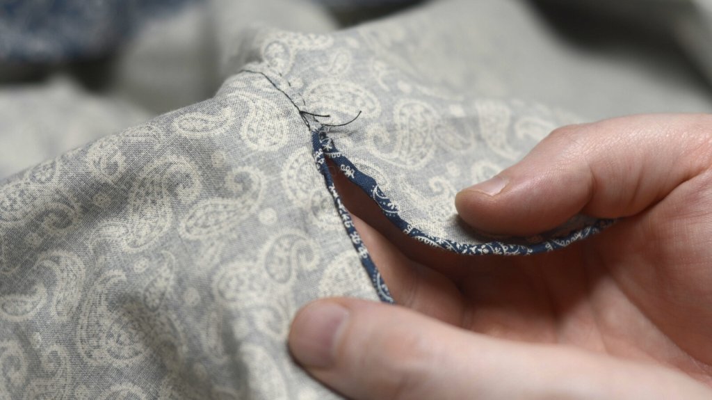 The hem tapers near the side seam.