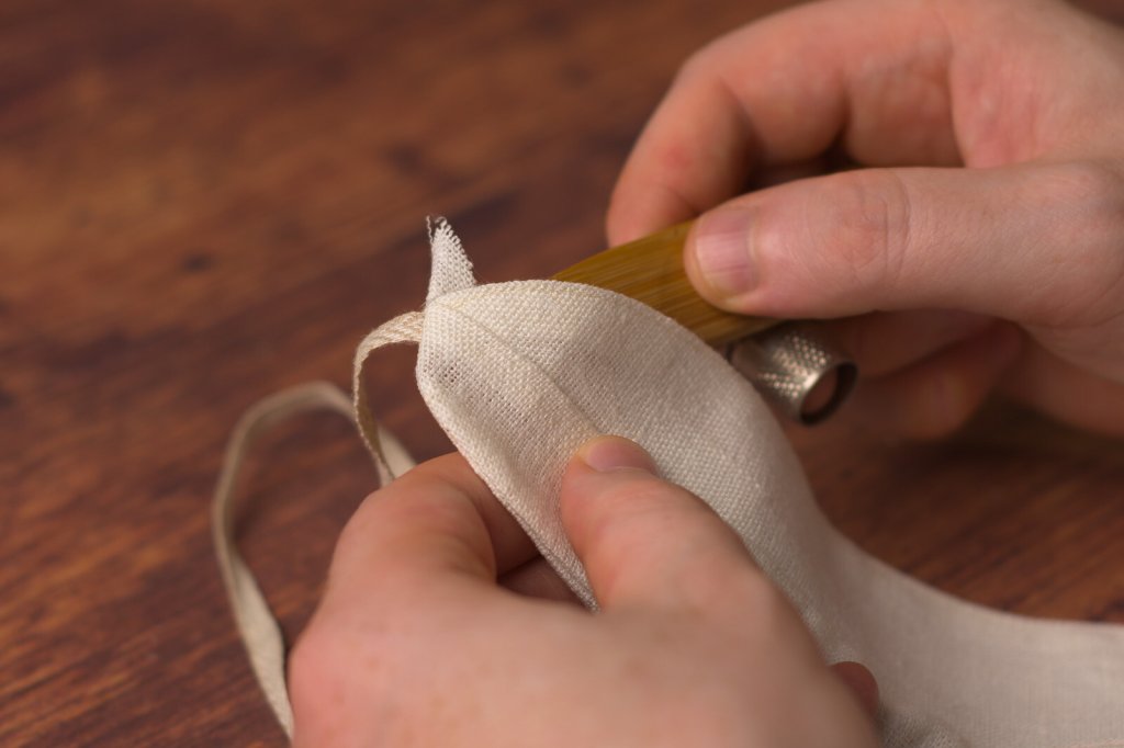 Turning a shirt collar right side out.