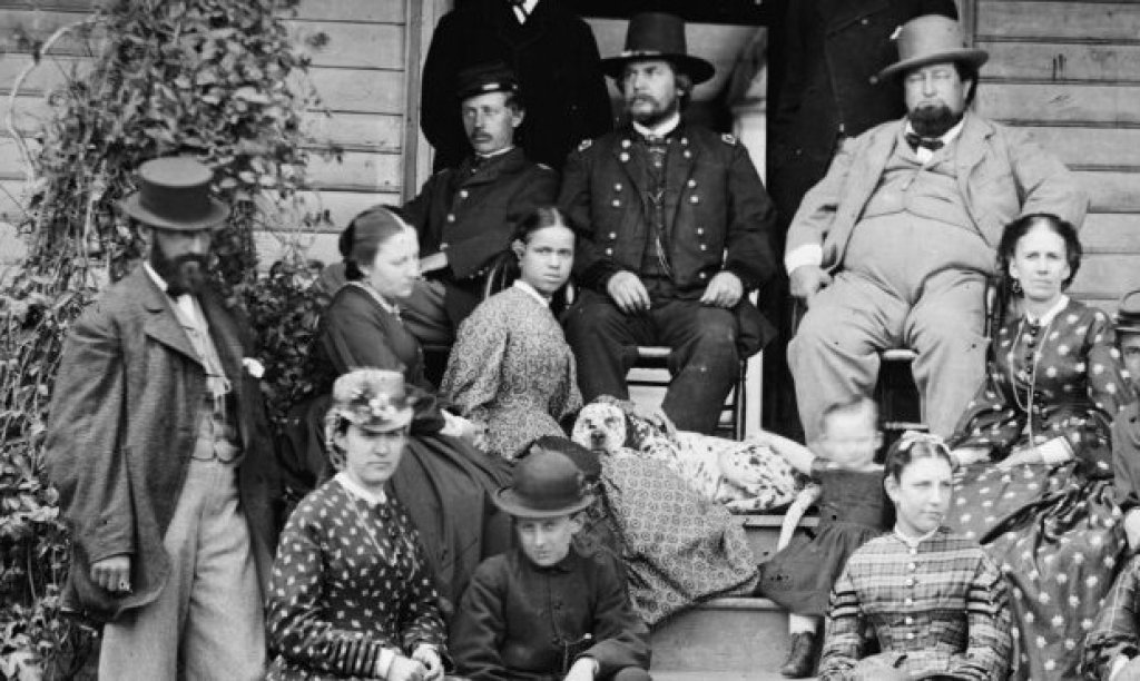 Group of men and women sitting for photograph.