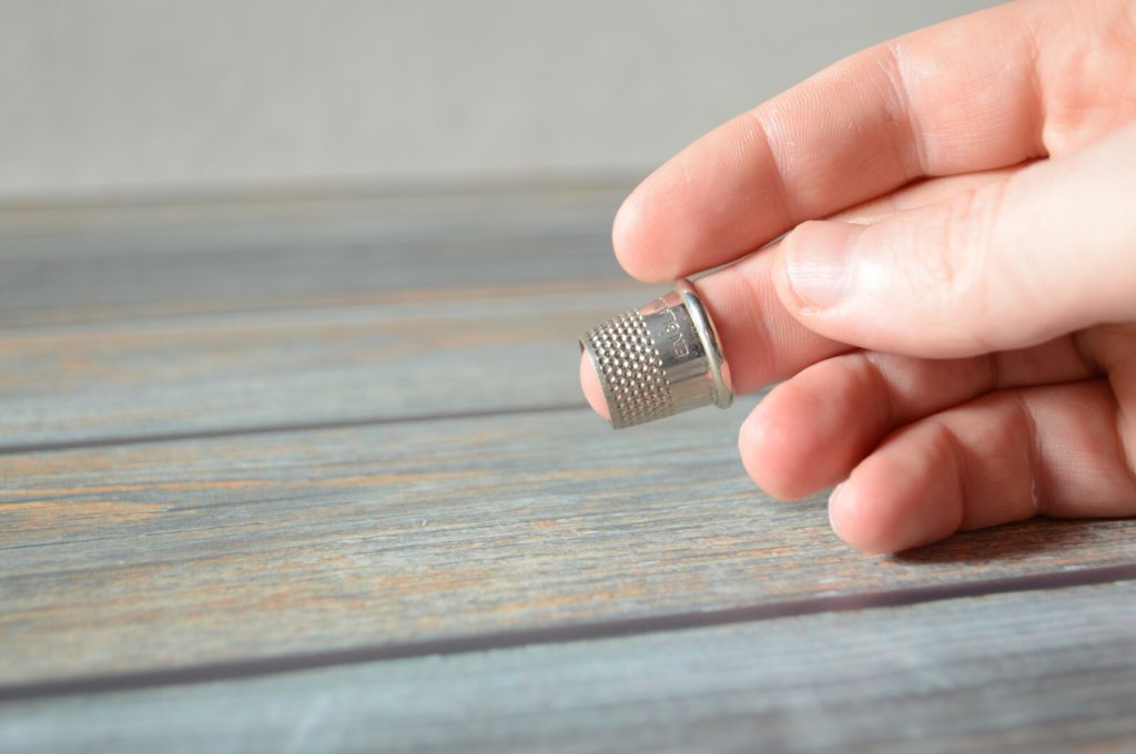 A fitted tailor's thimble.