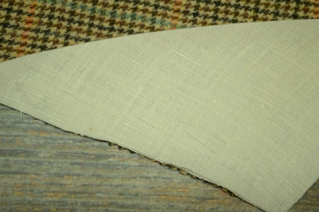 The basting stitches are kept out of the seam allowance.