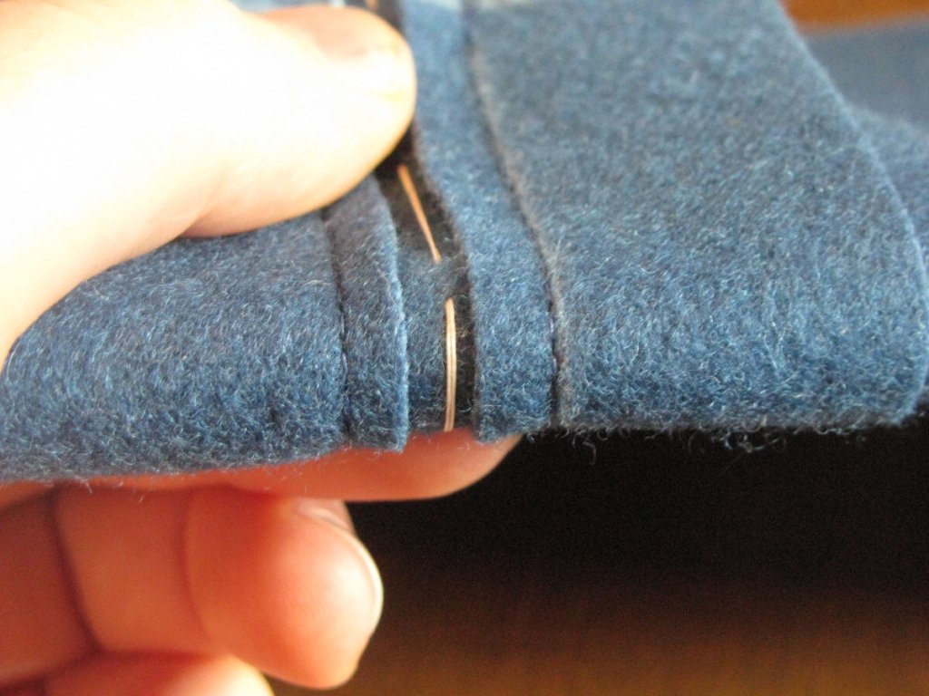 Fold the pocket in half, aligning the layers.