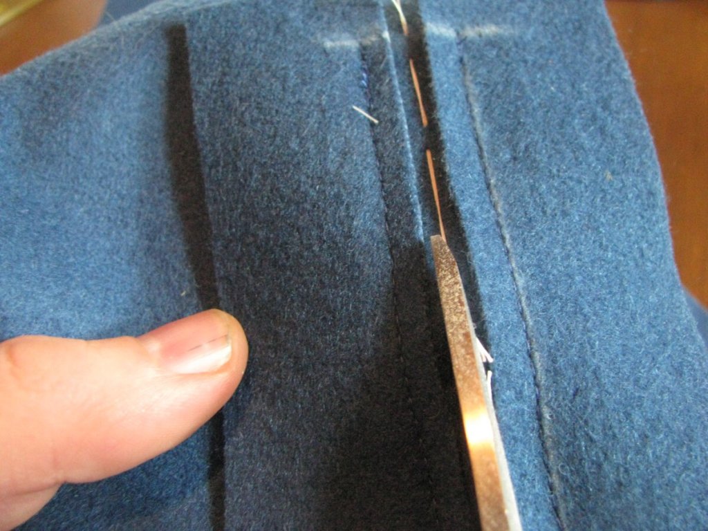 Continue cutting the pocket open, stopping 1/2" from either end.