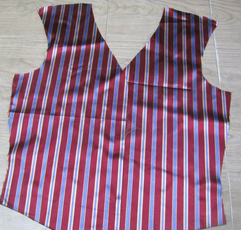 Silk fabric cut out into the shape of a waistcoat.
