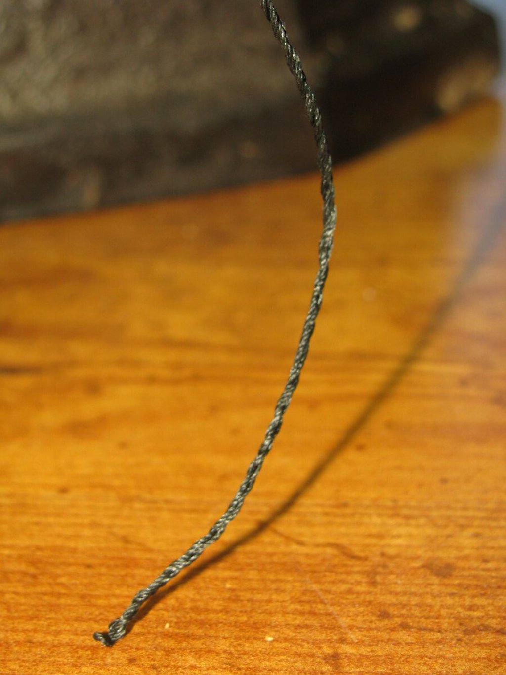 Fold the cord in half and allow it to twist around itself.