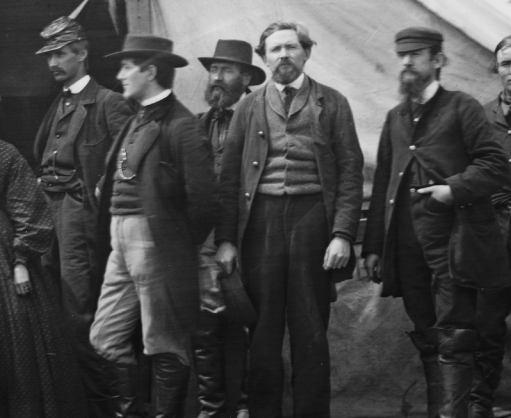 Photograph of gentlemen standing for a photograph.