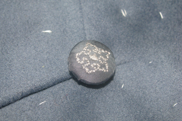 Silk-covered button.