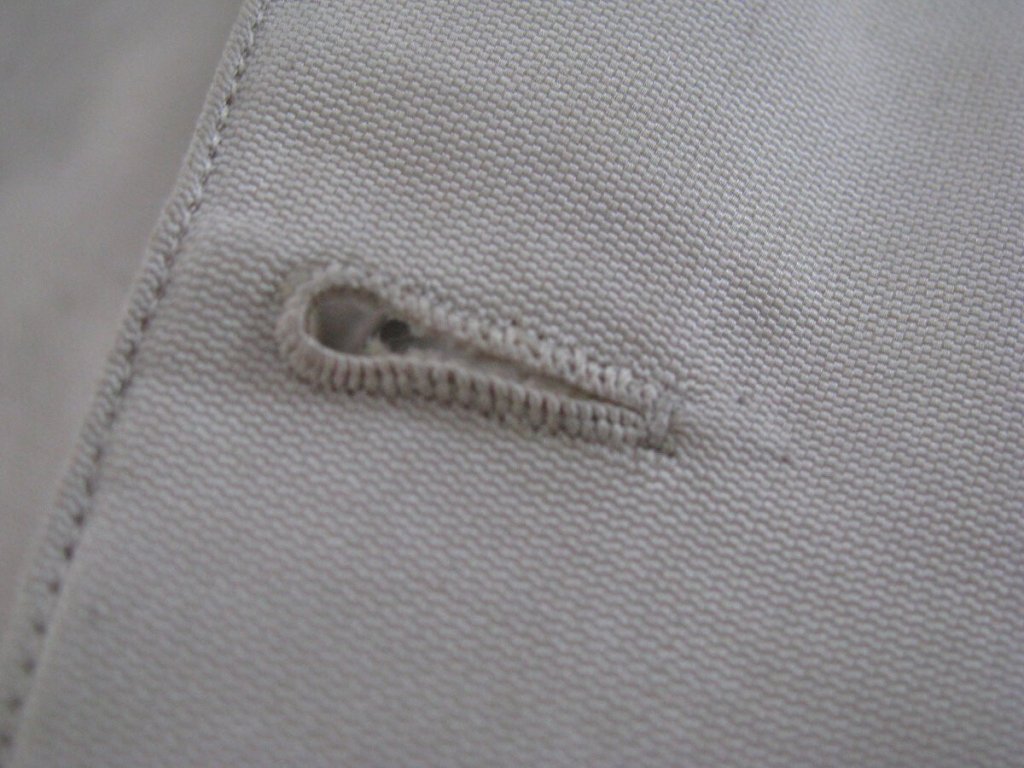 Buttonhole in white cloth.