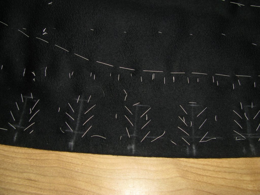 Baste around each buttonhole to secure the layers.